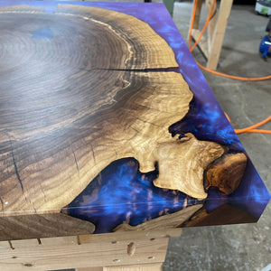 Walnut table example of purple and blue pigment that shows how if caught in a certain light it can eaither give one colour tone or another