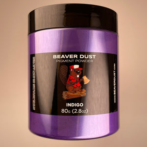 Logo of beaver sitting on log with axe in hand showing colour 