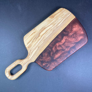 half olive wood half dark red pigment colour with a rounded edge and handle big enough to hang on a hook to display in your kitchen or be used to carry over cheese and meat when hosting your guests