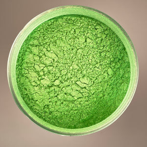 lime green colour in an arial shot of mica powder sitting in a container that can be resealed