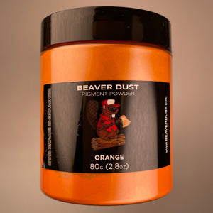 orange warm tone in a big pigment container with a fun label of a beaver sitting on a log on front