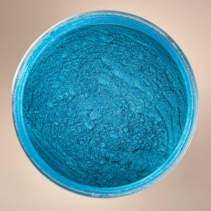 Sparkling mica powder for adding dimension to epoxy art called peacock green but really looks more like a blue