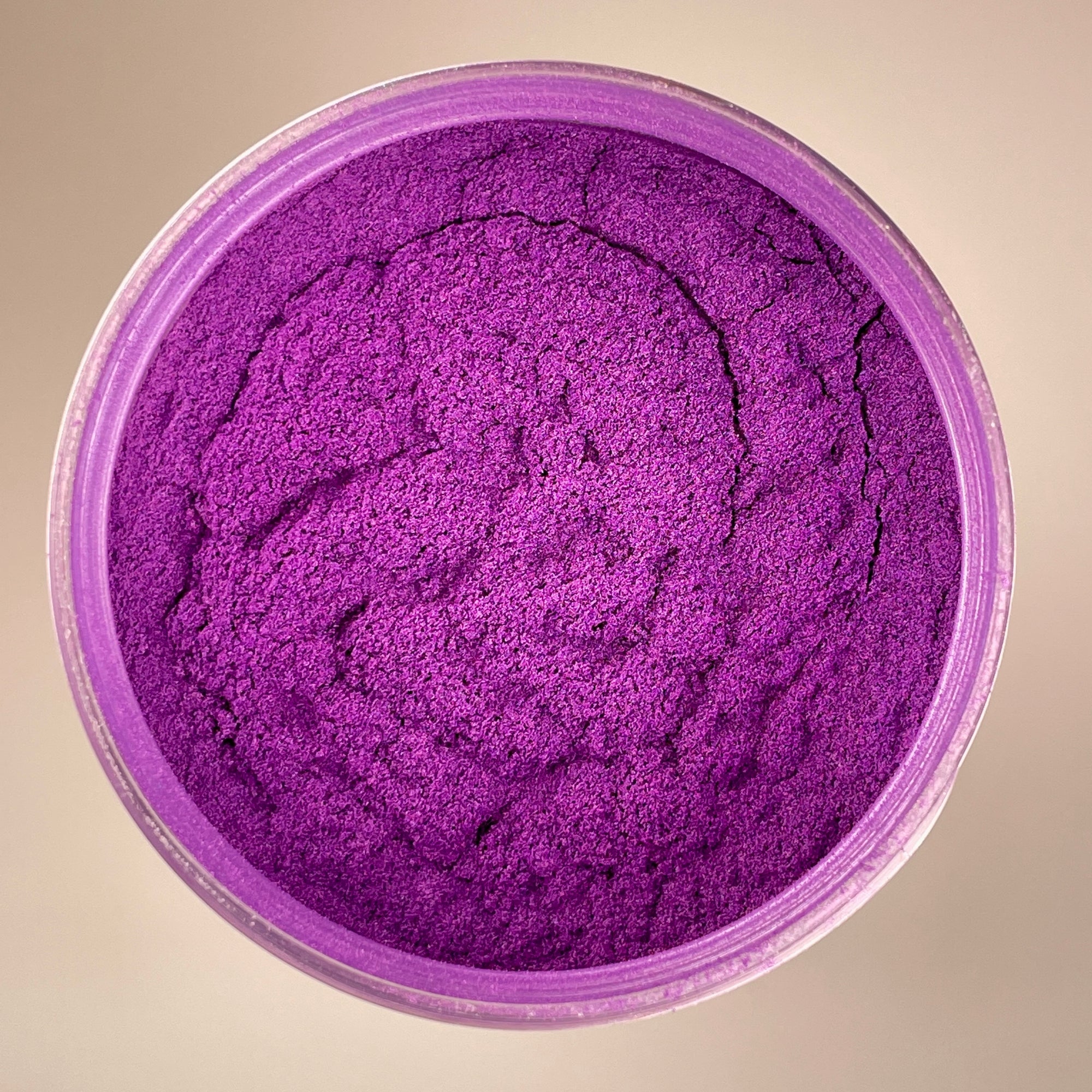 plum purple with a deep tone to it. fine pigment powder shot arial view